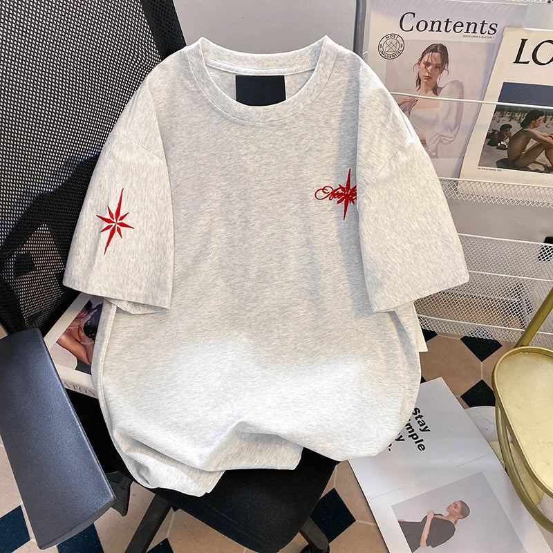 A unique one of a kind men's top featuring an embroidered eight pointed star