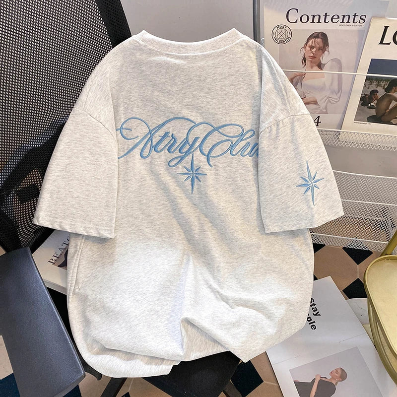 A unique one of a kind men's top featuring an embroidered eight pointed star
