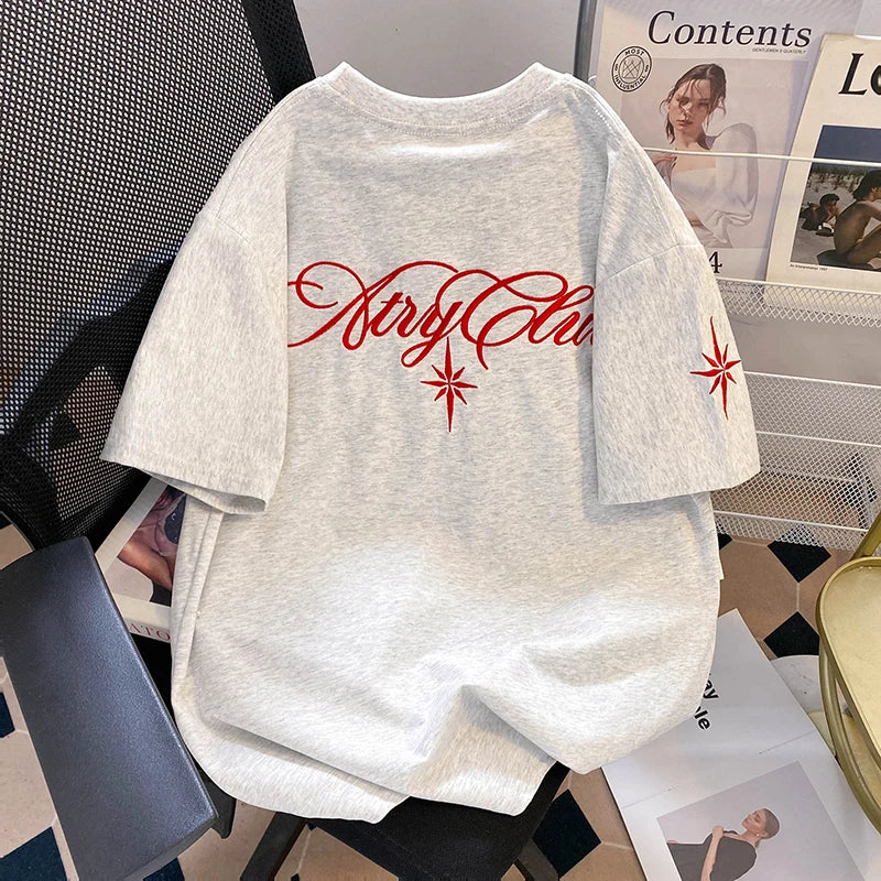 A unique one of a kind men's top featuring an embroidered eight pointed star